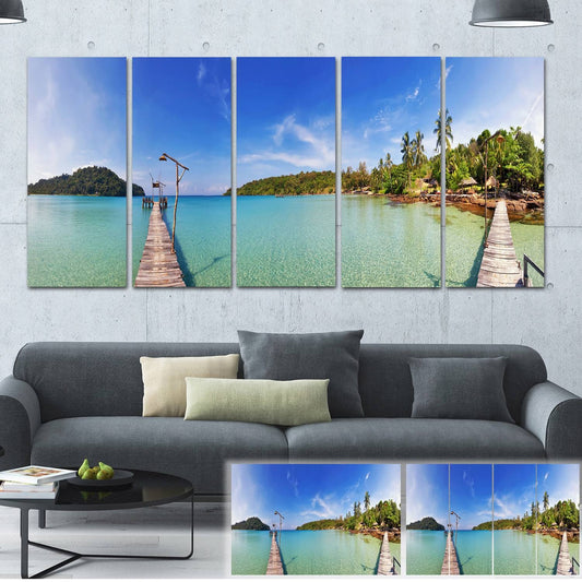 Designart Piers and Palm Trees on Island Landscape Photo Canvas Print - 60 in. Wide x 28 in. High - 5 Equal Panels ZVE1_W3ANS98